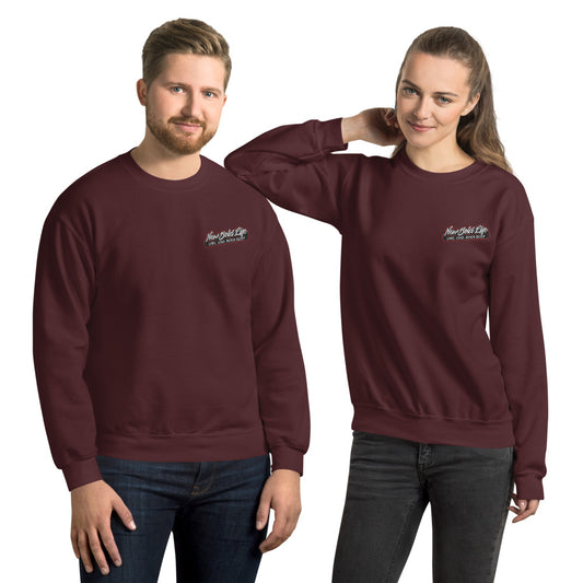 Image of two models wearing Unisex New Bold Life Sweatshirt - Unisex Wear. The sweatshirts are maroon colored with the Newboldlife logo on the front left chest. 