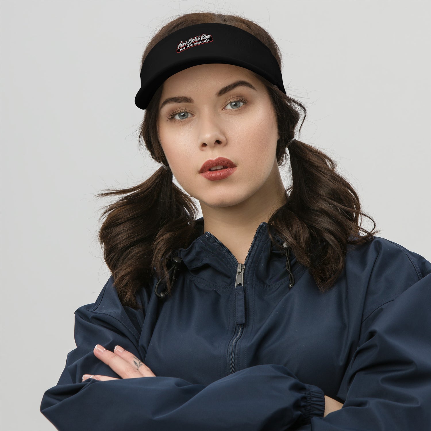 Image of a model wearing New Bold Life Visor - Hats. the hat is black with the Newboldlife logo on the front.